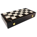 Gilded ebony and bordered marble patterned chess set